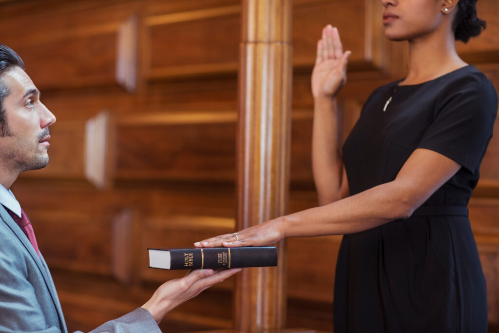 Bailiff giving oath to witness
